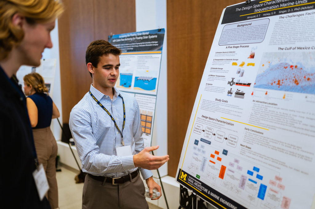 Student Ethan Almquist presents his research on The Design Space Characterization of Offshore Carbon Sequestration Marine Units to attendees at NASEC. 
