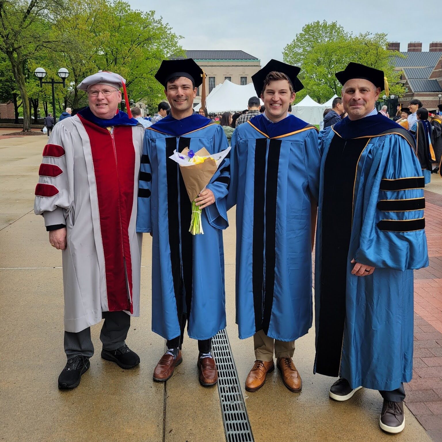 PhD students at Commencement with faculty advisors