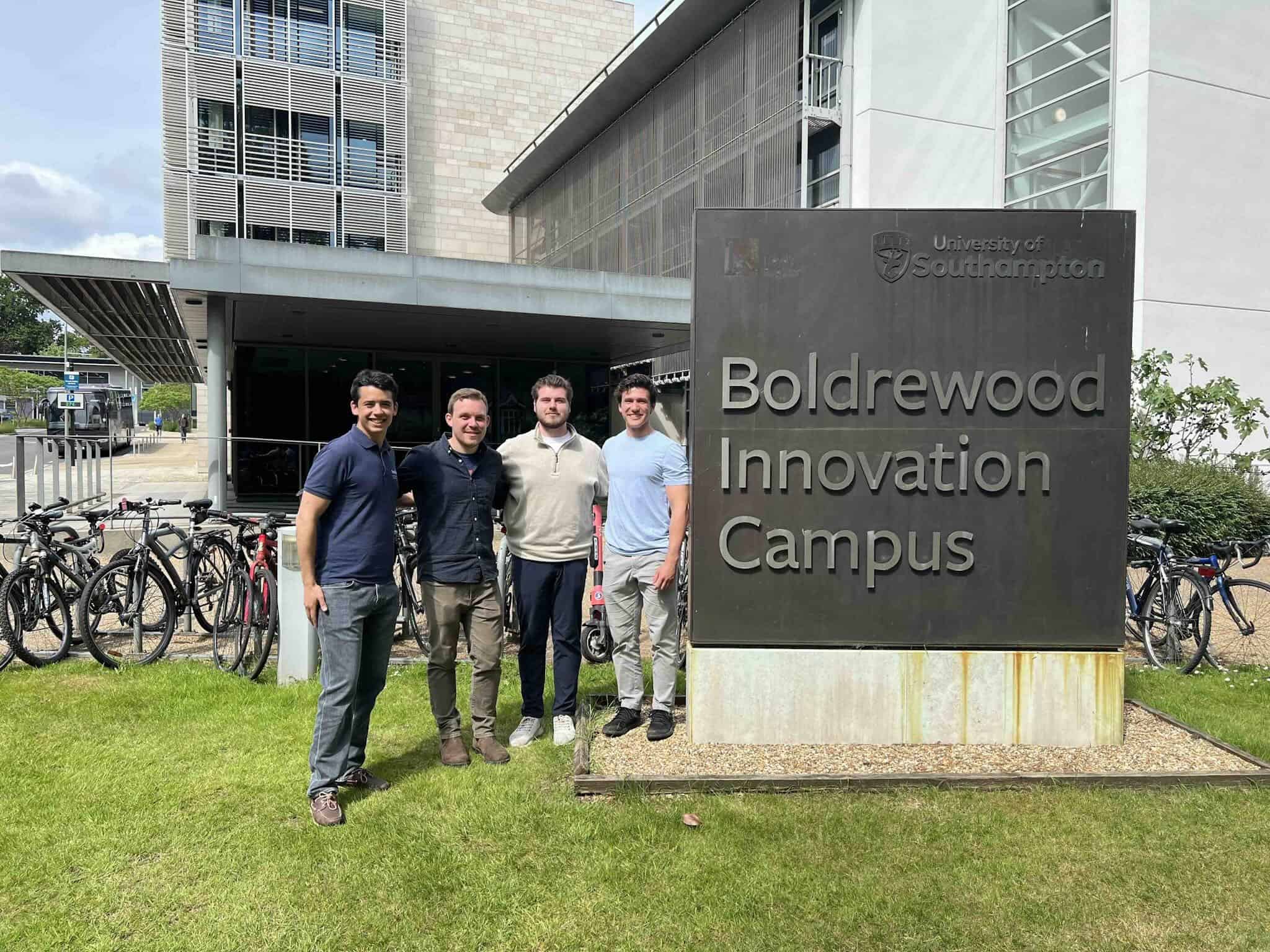 students gathered in front of bicycles and University of Southampton sign